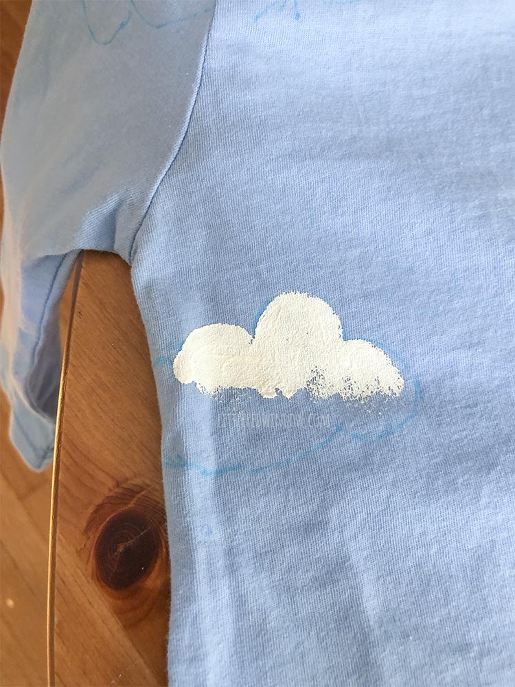 Fill in the clouds on your butterfly garden costume tshirt with white fabric paint!