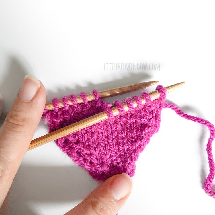 Work with only a few stitches at a time to form the top of the heart shape for the gathered heart hat knitting pattern!