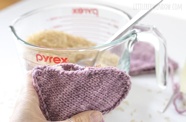 To assemble the heart shaped handwarmer knitting pattern, fill your handwarmers with dried rice.