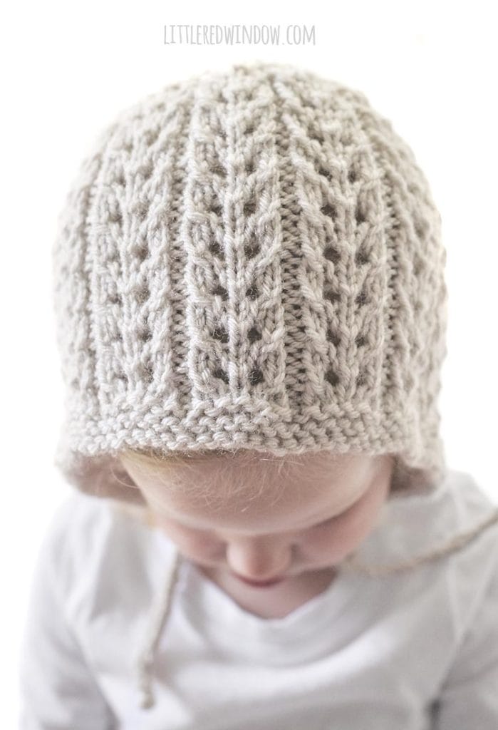 This easy ribbed lace knitting stitch makes the Flutter Lace Baby Bonnet knitting pattern so special and unique!