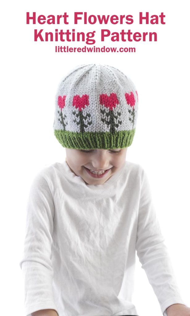 This cute heart flowers hat has bright colorful heart shaped flowers knit around the brim, perfect for Valentine's day for your baby or toddler!