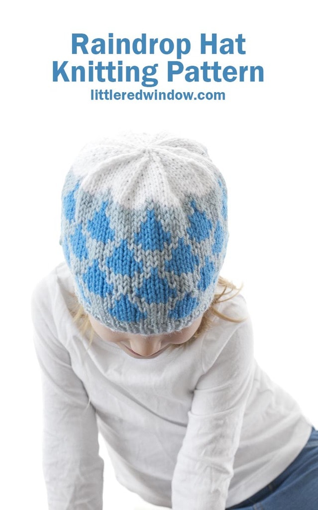 This cute raindrop hat knitting pattern has blue raindrops and a white fluffy cloud on top, it's a perfect spring knit for your baby or toddler!