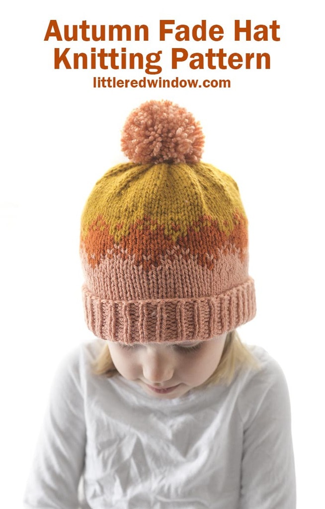 little girl wearing pink rust and mustard colored autumn fade hat knitting pattern and looking down