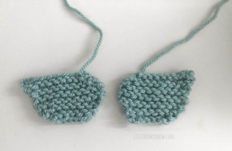 two knit bluebird wings laying on a white background