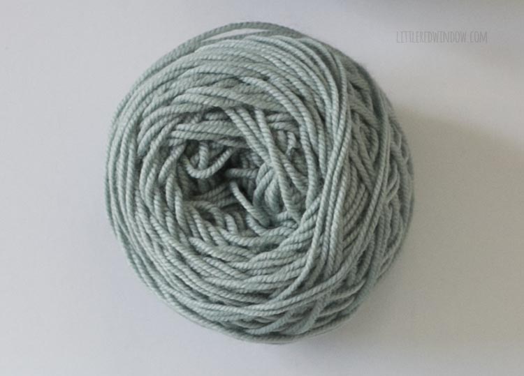 dusty light teal center pull ball of yarn on a white background