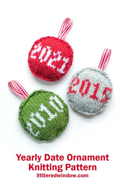three round knit ornaments in red green and gray with the numbers 2021 2015 and 2010 on them
