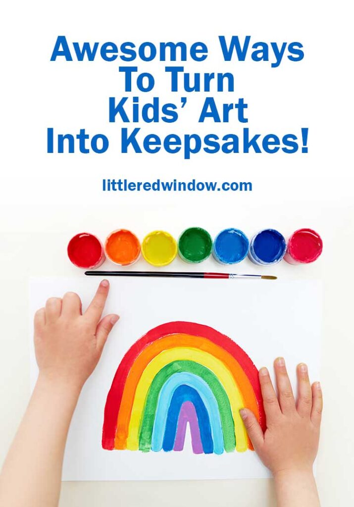 kids hands with a set of paints and a painting of a rainbow on a white background
