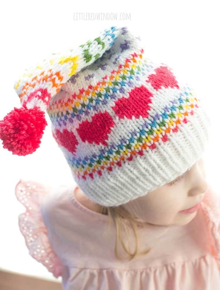 closeup of hot pink hearts and rainbow fair isle pattern on the rainbow love stocking cap knitting pattern