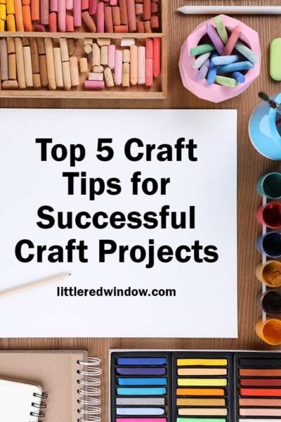 tabletop with chalks and paints around a large white piece of paper with the words top 5 craft tips for successful craft projects