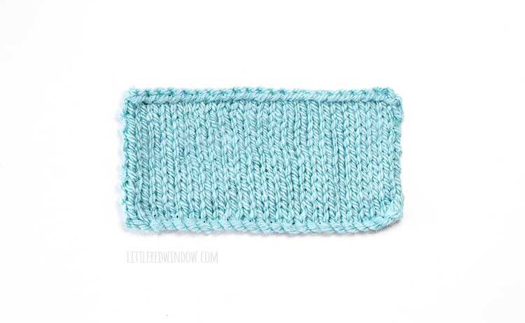 light blue rectangle knitting swatch on a white background showing cable cast on method