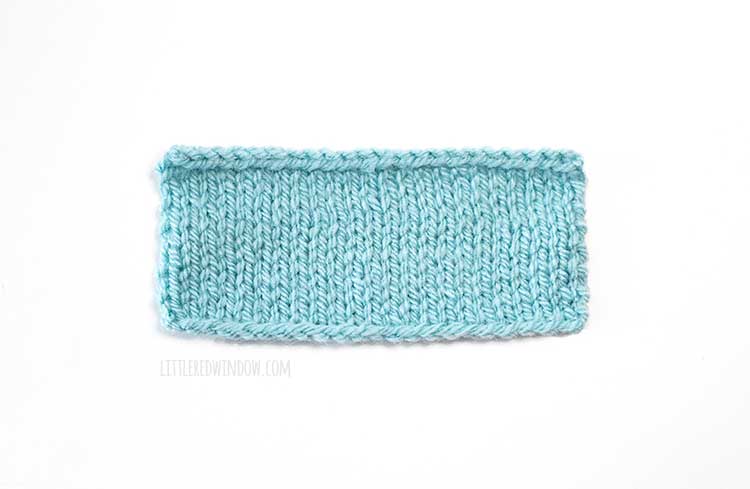 light blue rectangle knitting swatch on a white background showing longtail cast on method