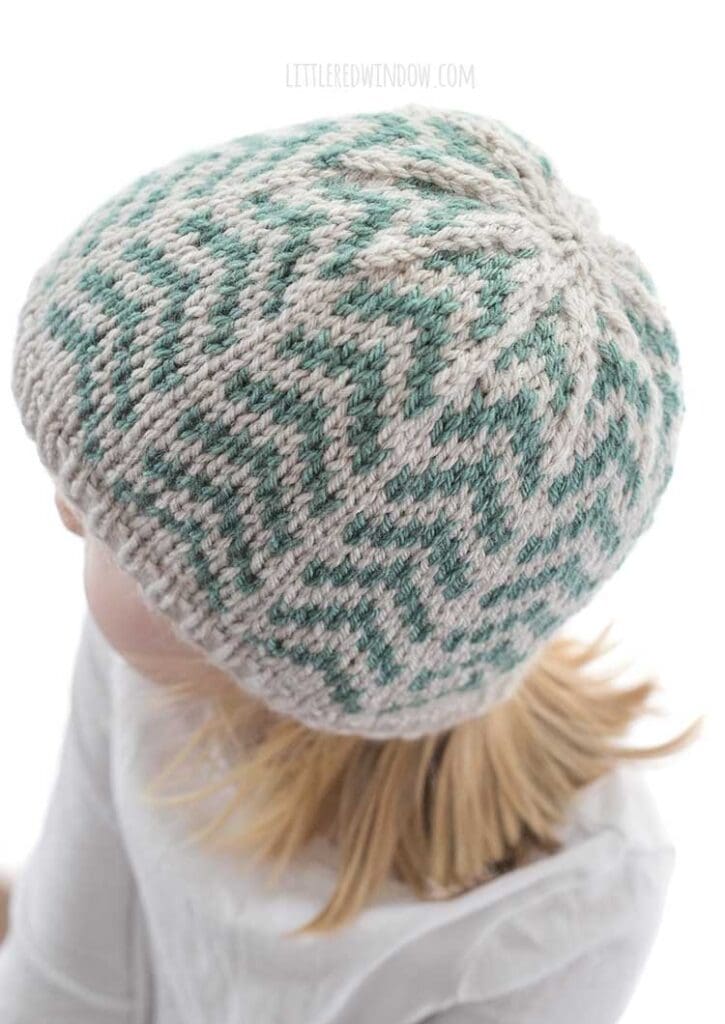 top back view of girl wearing converging arrows hat knitting pattern