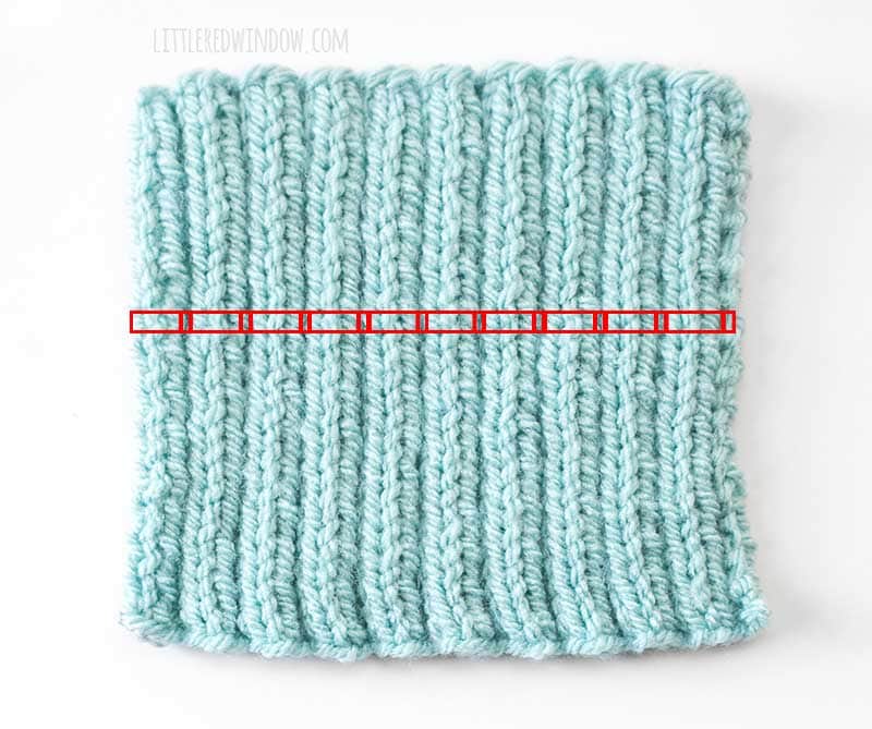 light blue swatch of 2 by 2 ribbing with each stitch in a row highlighted in red