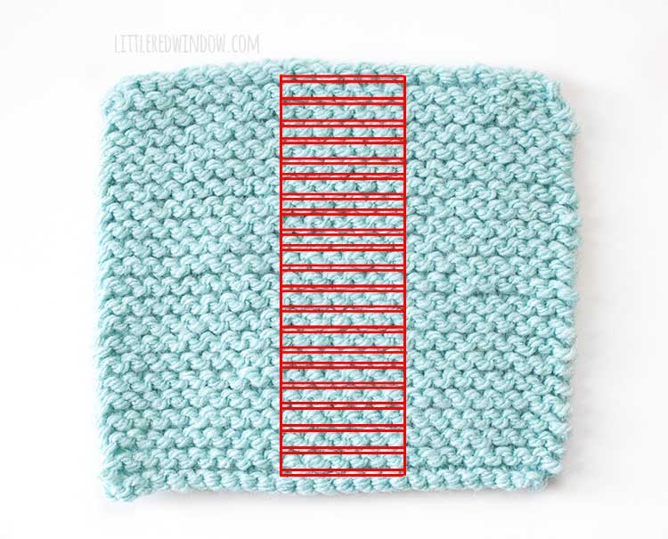 light blue swatch of garter stitch knitting with the rows outlined in red rectangles