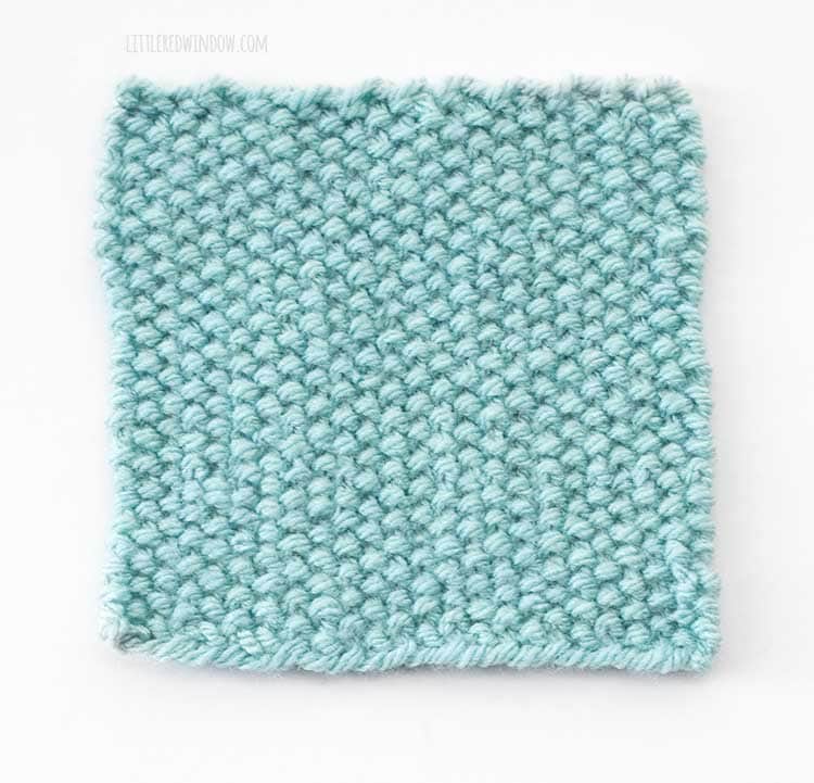 a light blue swatch on a white background showing the wrong side of linen stitch knitting