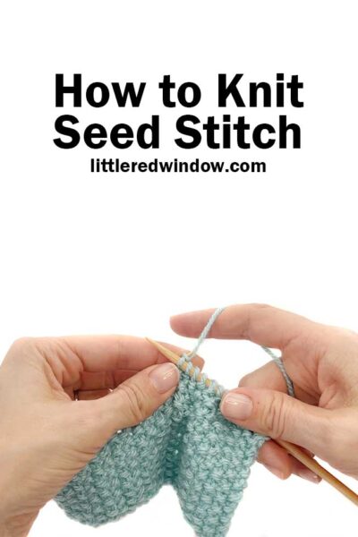 Two hands holding knitting needles and light blue yarn knitting the seed stitch pattern