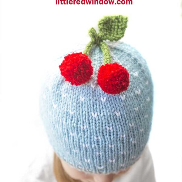 The cheerful cherry hat knitting pattern is a fun, happy, adorable hat to knit for your newborn, baby or toddler this year!