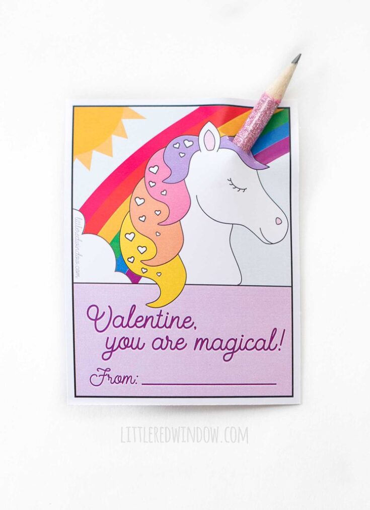 one printed unicorn valentine card with a pink glittery pencil coming through the top to look like unicorn horns on a white background