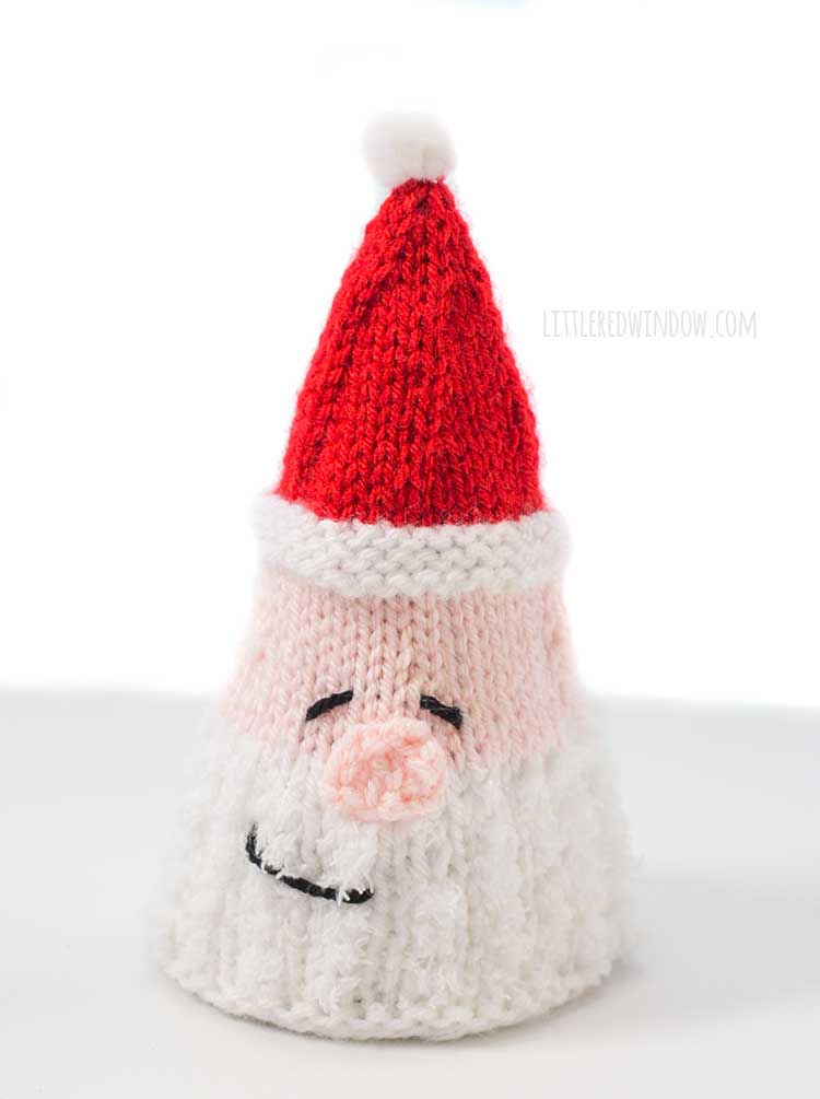 a knit cone tree that looks like Santa's head with white heard and red hat