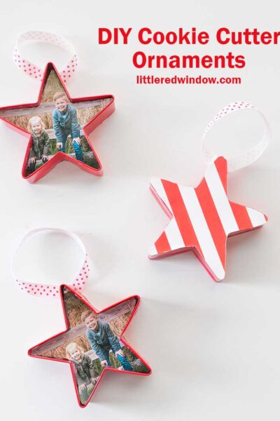 three red star shaped cookie cutter ornaments on a white background