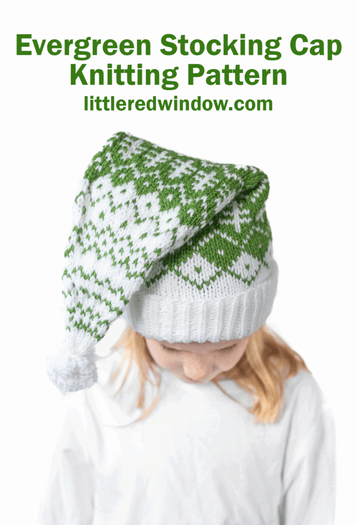 A child wearing an evergreen stocking cap with a green and white knit design and pom-pom looks down. Text above reads: "Evergreen Stocking Cap Knitting Pattern littleredwindow.com".
