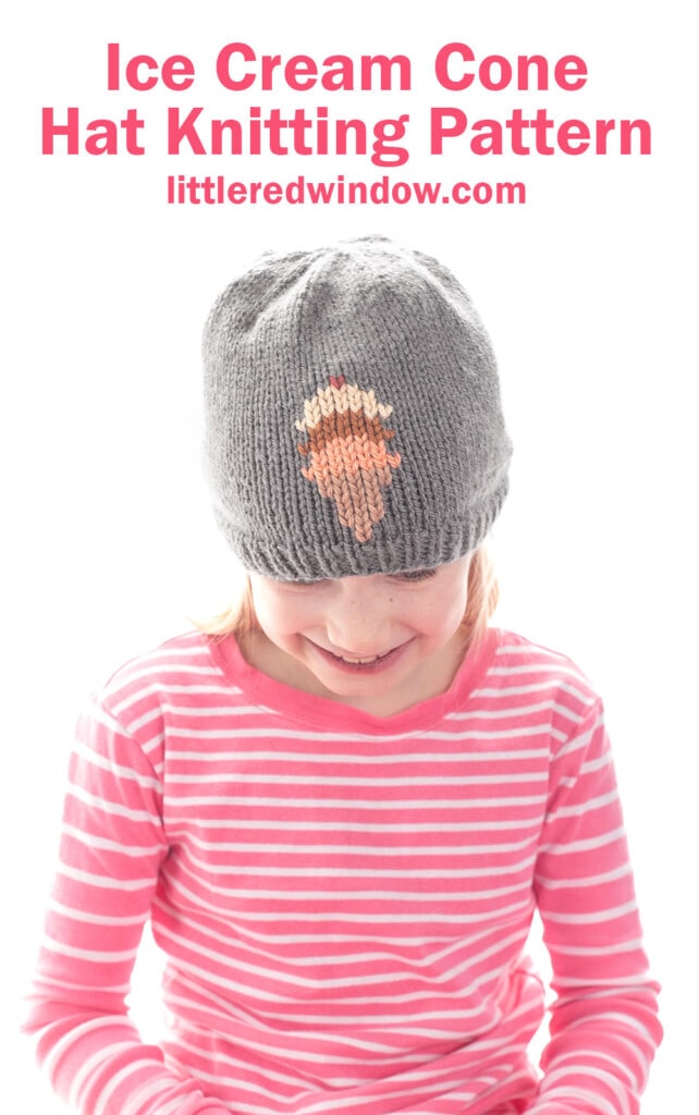 A young child wearing an adorable ice cream cone hat with a gray knit design and a pink and white striped shirt smiles. Text above reads,
