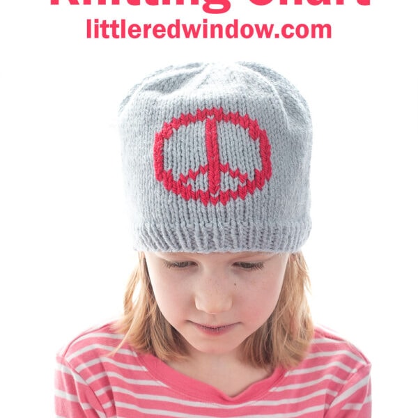 A young girl wearing a gray knitted hat with a red peace sign design looks down. She is dressed in a pink and white striped shirt. Text above reads: