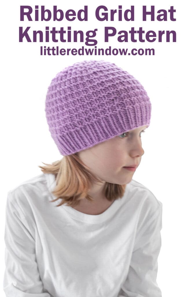 A young child wearing a lavender ribbed grid knit hat and a white shirt looks to the side. Text above reads: